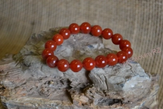 Náramek z minerálních kuliček, karneol tmavý, průměr kuličky 10 mm